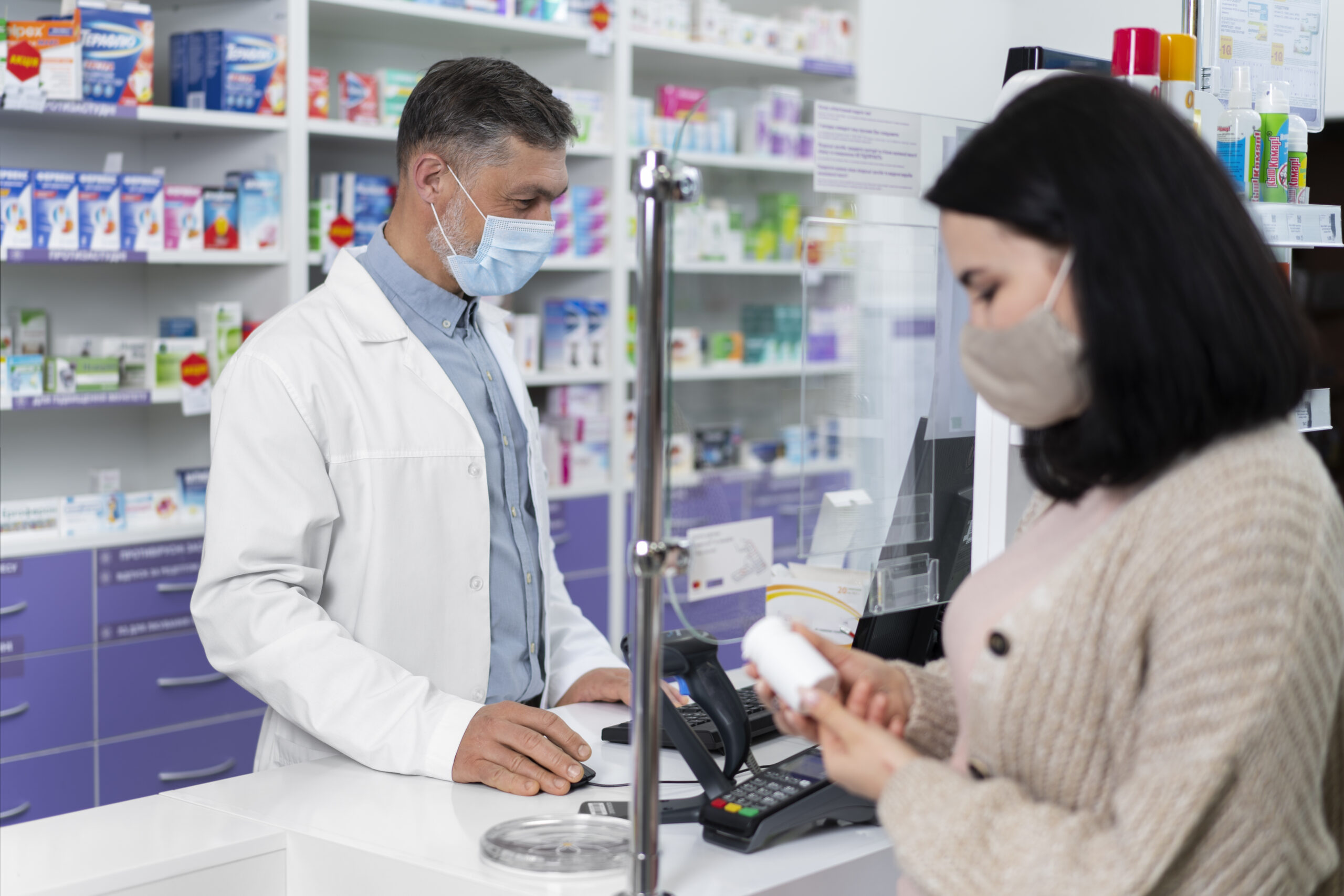 medium shot pharmacist helping patient scaled
